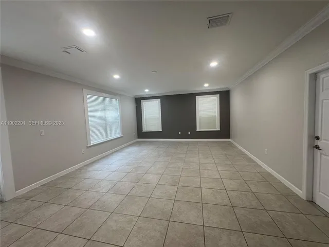 a bathroom with a double vanity sink toilet mirror and shower