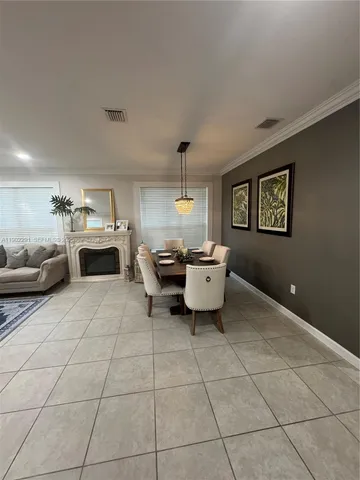 a living room with furniture and a stove top oven