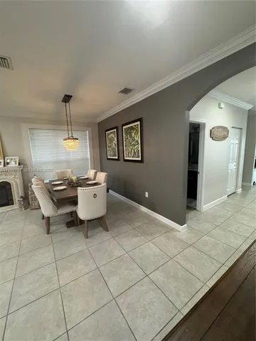 a view of an empty room with staircase