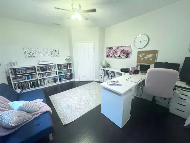 a front view of a house with sitting area