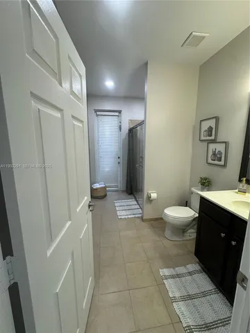 a view of a house with a tree