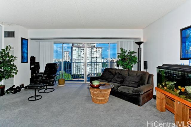 710 Lunalilo Street, Unit 901 Honolulu, HI 96813 - Photo 1 of 1 a living room with furniture floor to ceiling window and potted plant