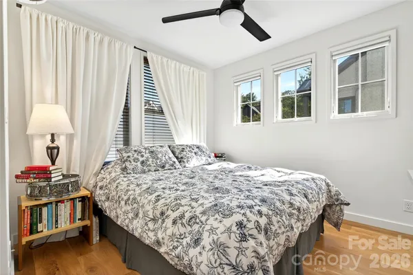 a bedroom with bed and a window