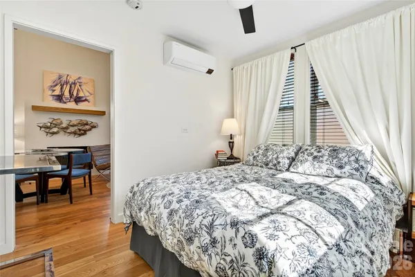 a bedroom with a bed and a table in it