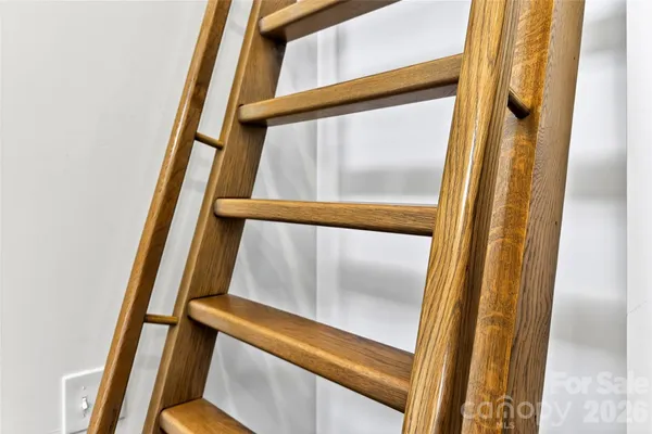 a living room with lots of furniture and a wooden floor