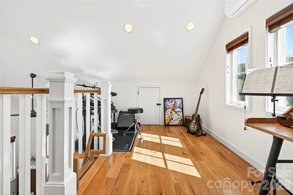 a view of a livingroom with furniture and workspace