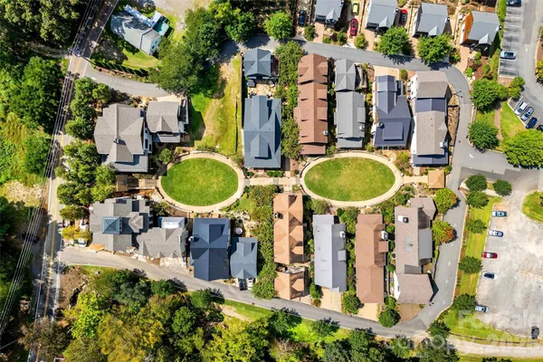 an aerial view of residential houses and outdoor space