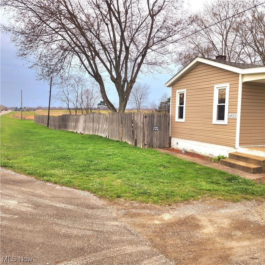 6923 Alliance Road Northwest Malvern, OH 44644 - Photo 5 of 24 Showing back yard, some fence needs repaired