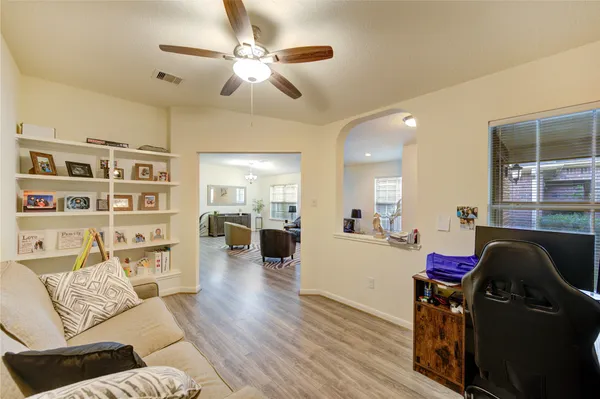 a living room with furniture and decor