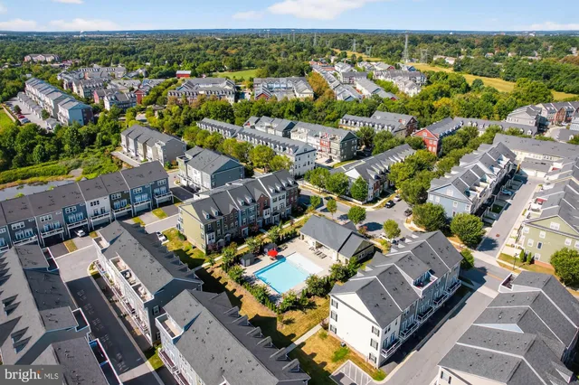 an aerial view of residential building and lake