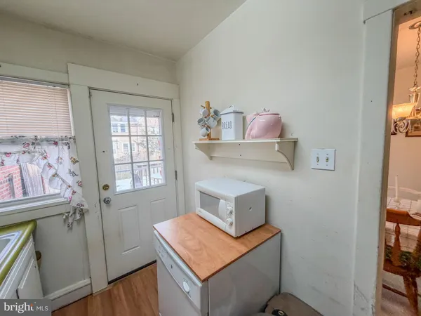 a living room with a couch and a window