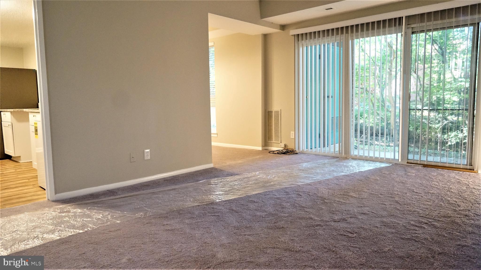 11818 Breton Court, Unit 1A Reston, VA 20191 - Photo 12 of 38 a view of an empty room with a window