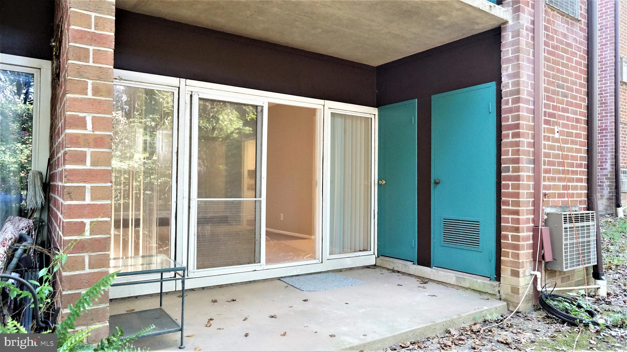 11818 Breton Court, Unit 1A Reston, VA 20191 - Photo 15 of 38 a view of a brick house with a large windows