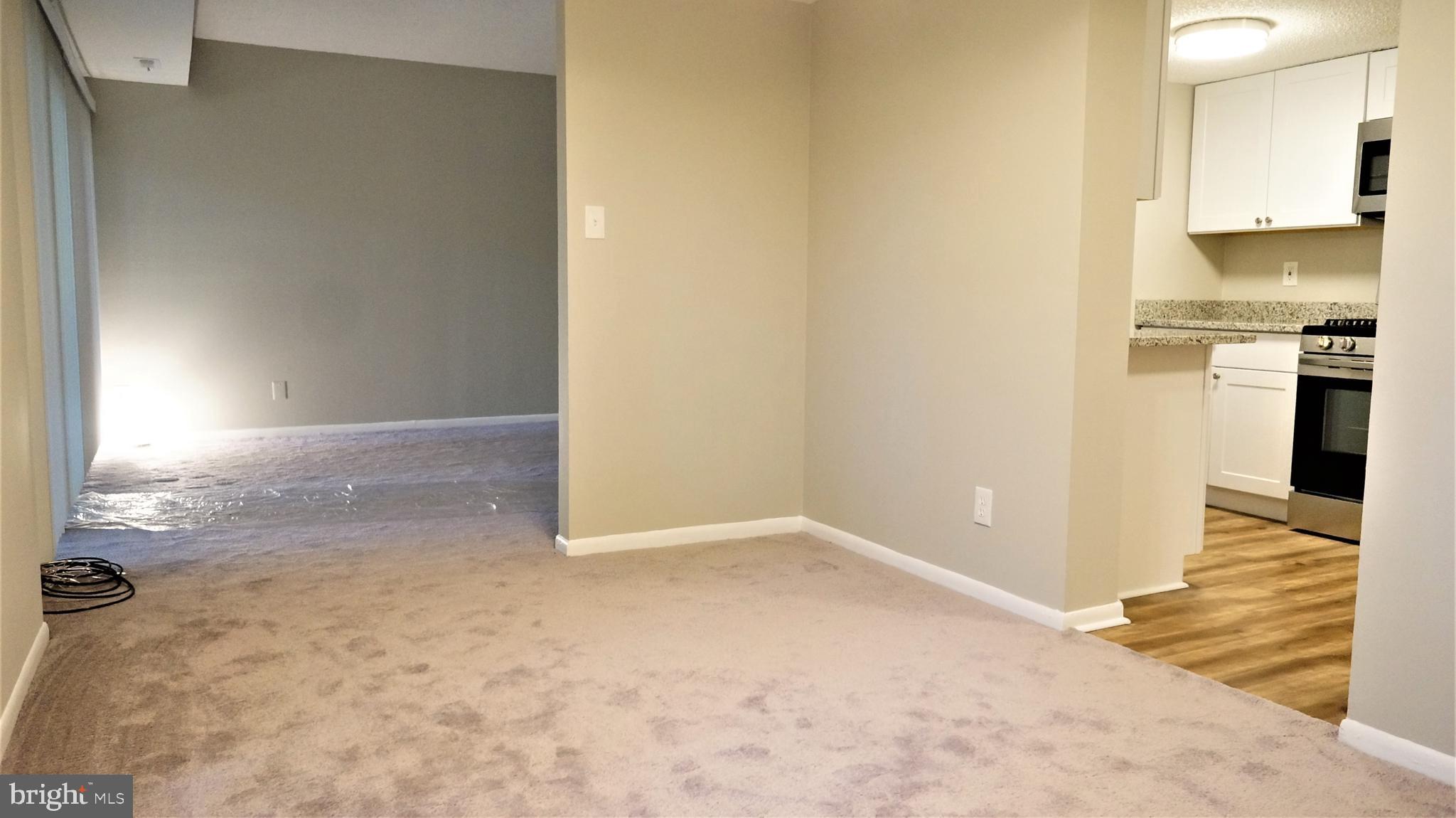 11818 Breton Court, Unit 1A Reston, VA 20191 - Photo 20 of 38 a view of a kitchen from the hallway