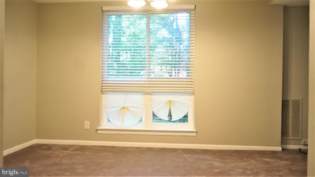a view of a room that has a window