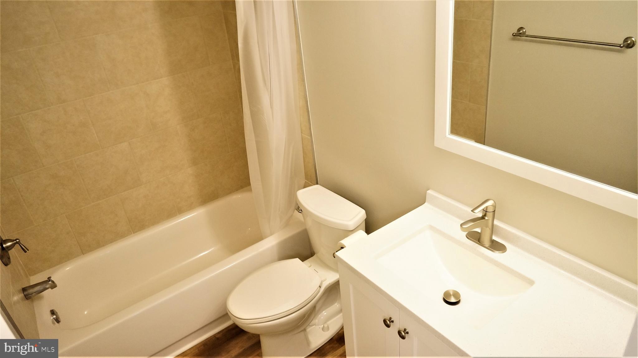 11818 Breton Court, Unit 1A Reston, VA 20191 - Photo 35 of 38 a bathroom with a sink and a toilet
