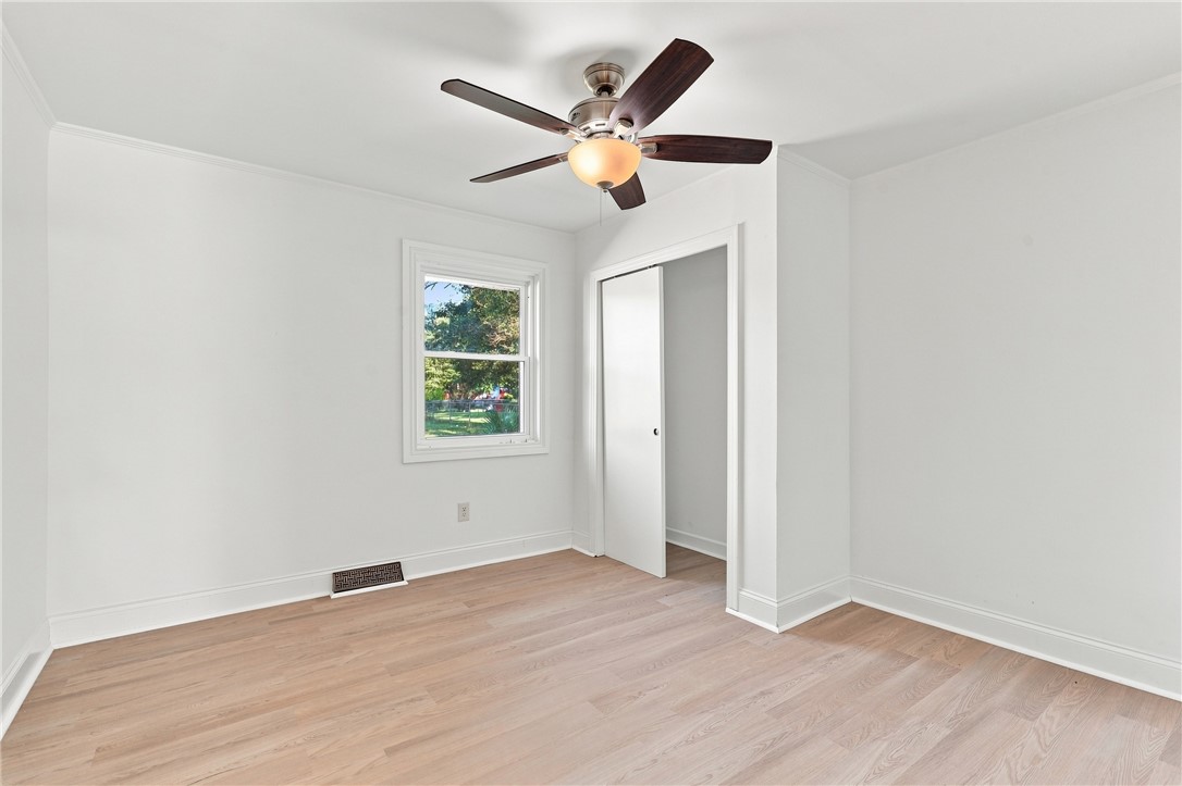 205 Timms Road Piedmont, SC 29673 - Photo 18 of 36 Smooth floors and classic crown molding define this bright, versatile bedroom space.