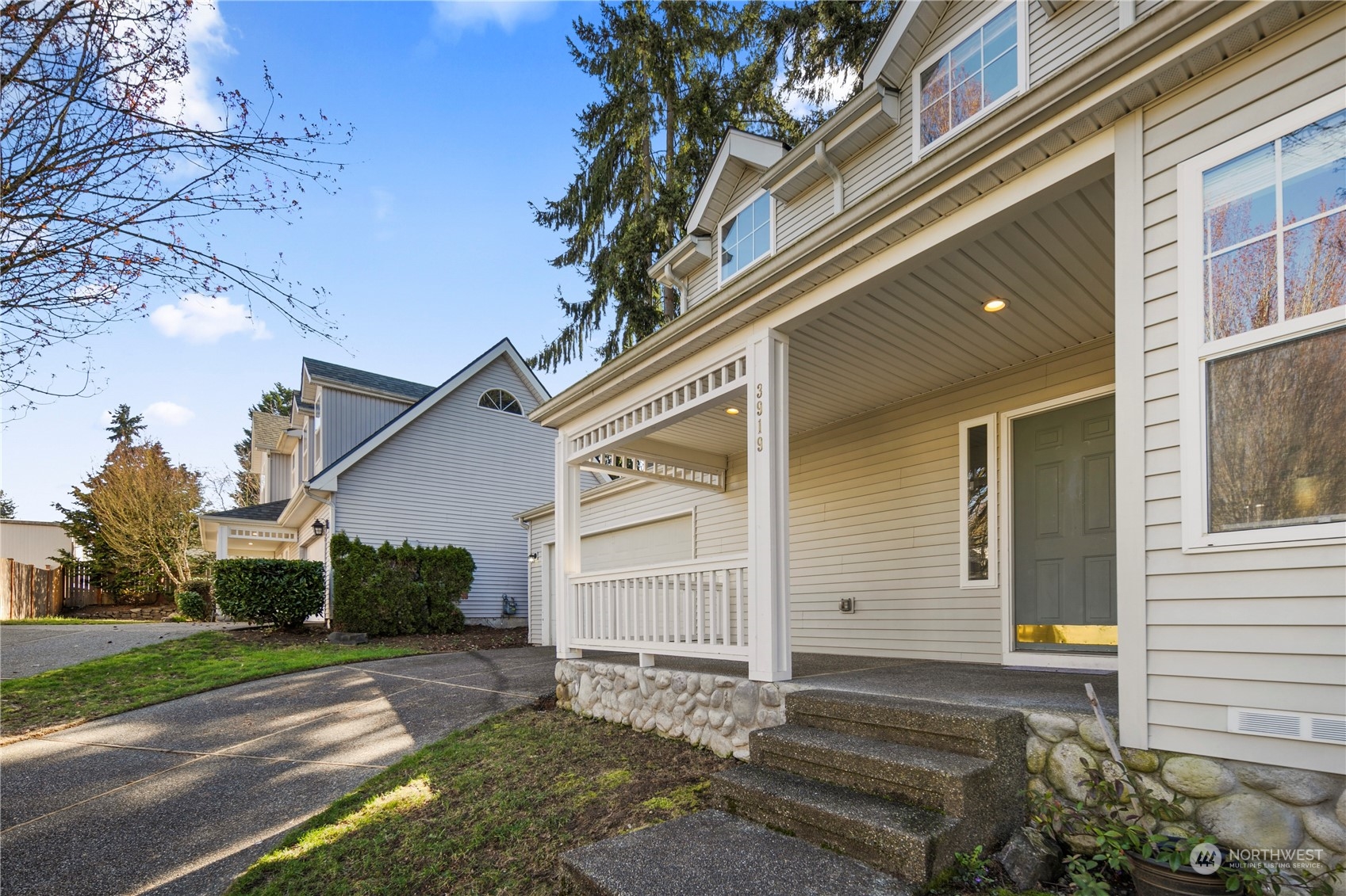 3919 Northeast 5th Street Renton, WA 98056 - Photo 2 of 37 a front view of a house with a yard