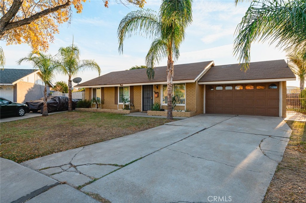 4710 Corwin Lane Riverside, CA 92503 - Photo 1 of 1 a front view of a house with a garden