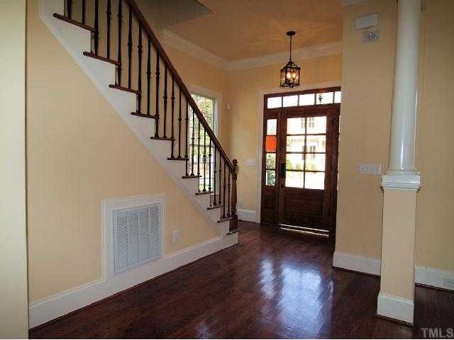 3109 Raymond Street Raleigh, NC 27607 - Photo 2 of 12 Gorgeous foyer with decorative columns and iron railing along staircase.