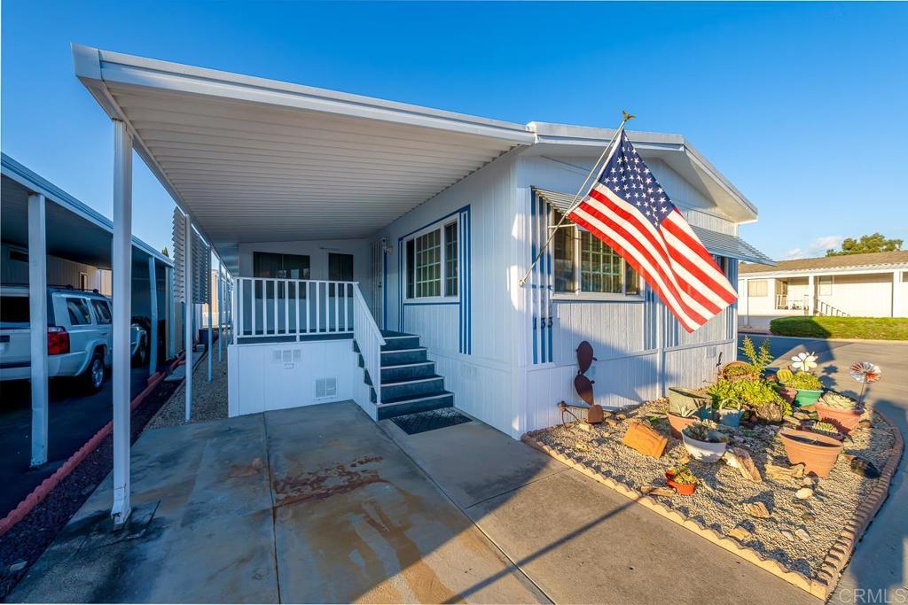 11949 Riverside Drive, Unit 133 Lakeside, CA 92040 - Photo 1 of 28 a front view of a house with entryway