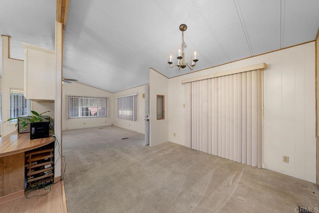 11949 Riverside Drive, Unit 133 Lakeside, CA 92040 - Photo 6 of 28 a view of a livingroom with furniture and chandelier