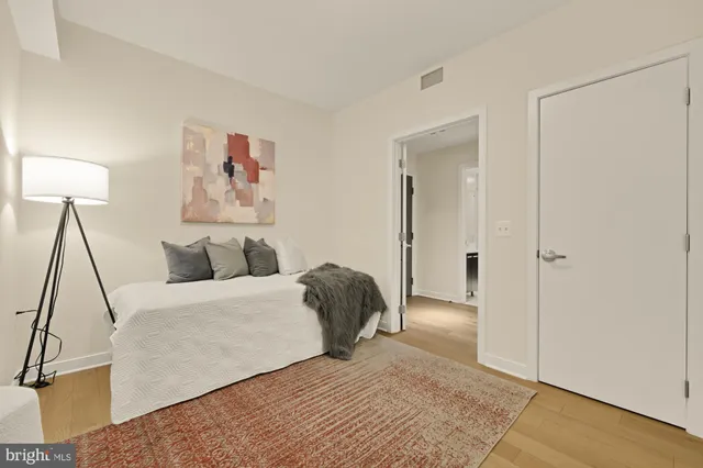 a bedroom with a bed and a walk in closet