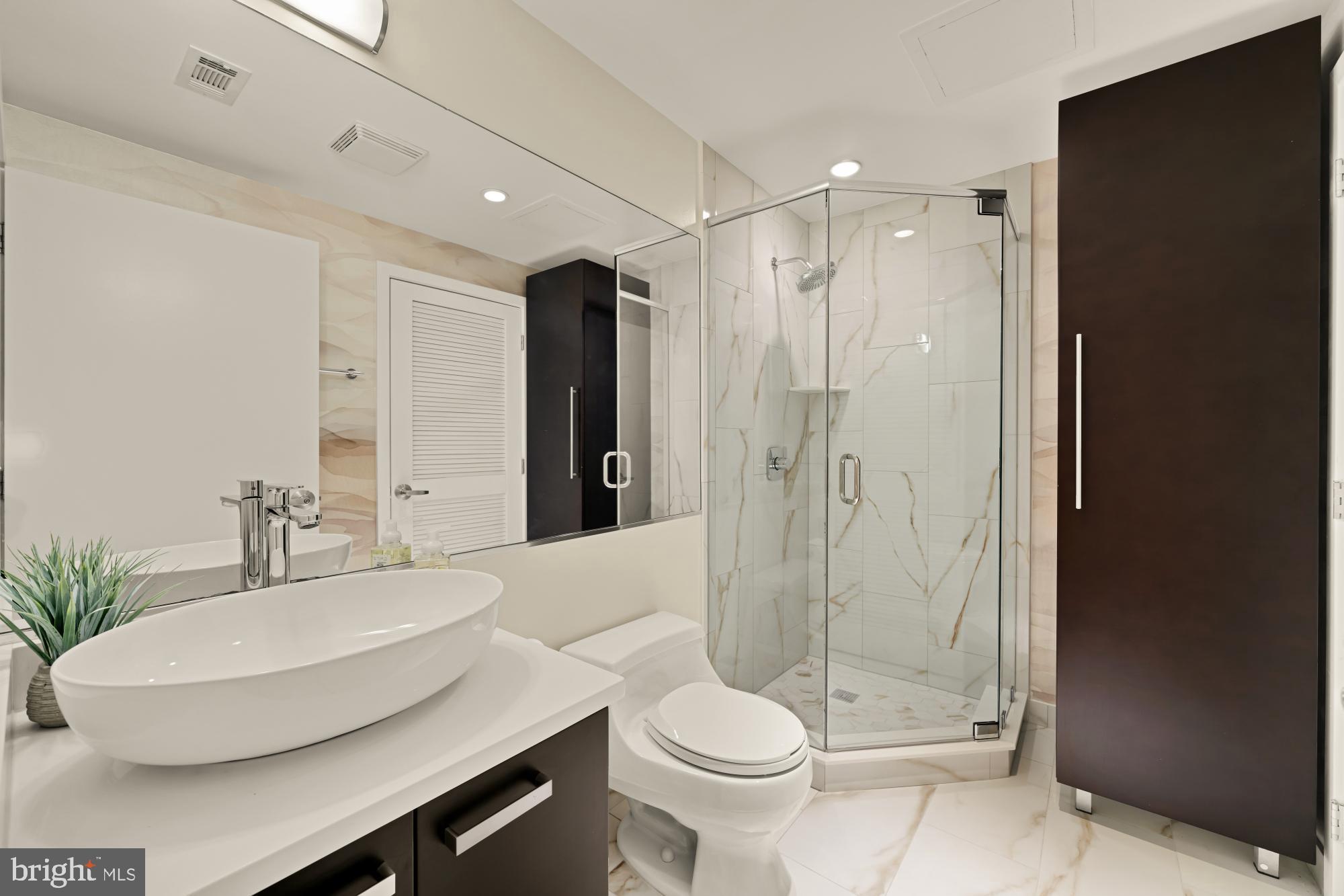 1010 Massachusetts Avenue Northwest, Unit 207 Washington, DC 20001 - Photo 20 of 31 a bathroom with a sink toilet and shower