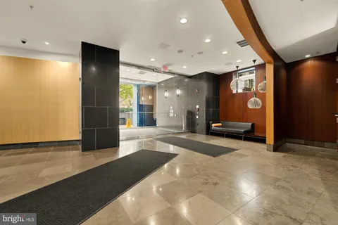 a view of a lobby with furniture and a large window