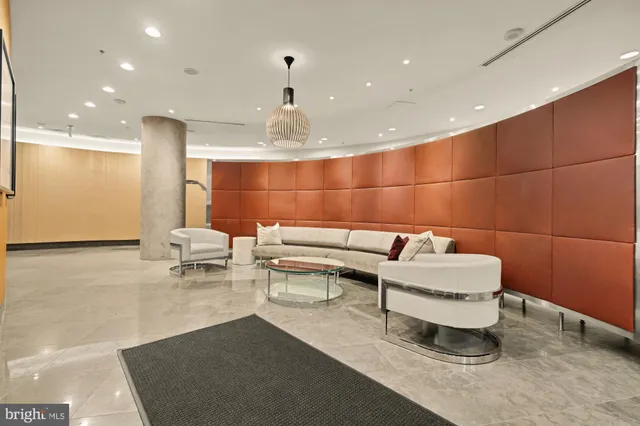 a view of a living room and kitchen
