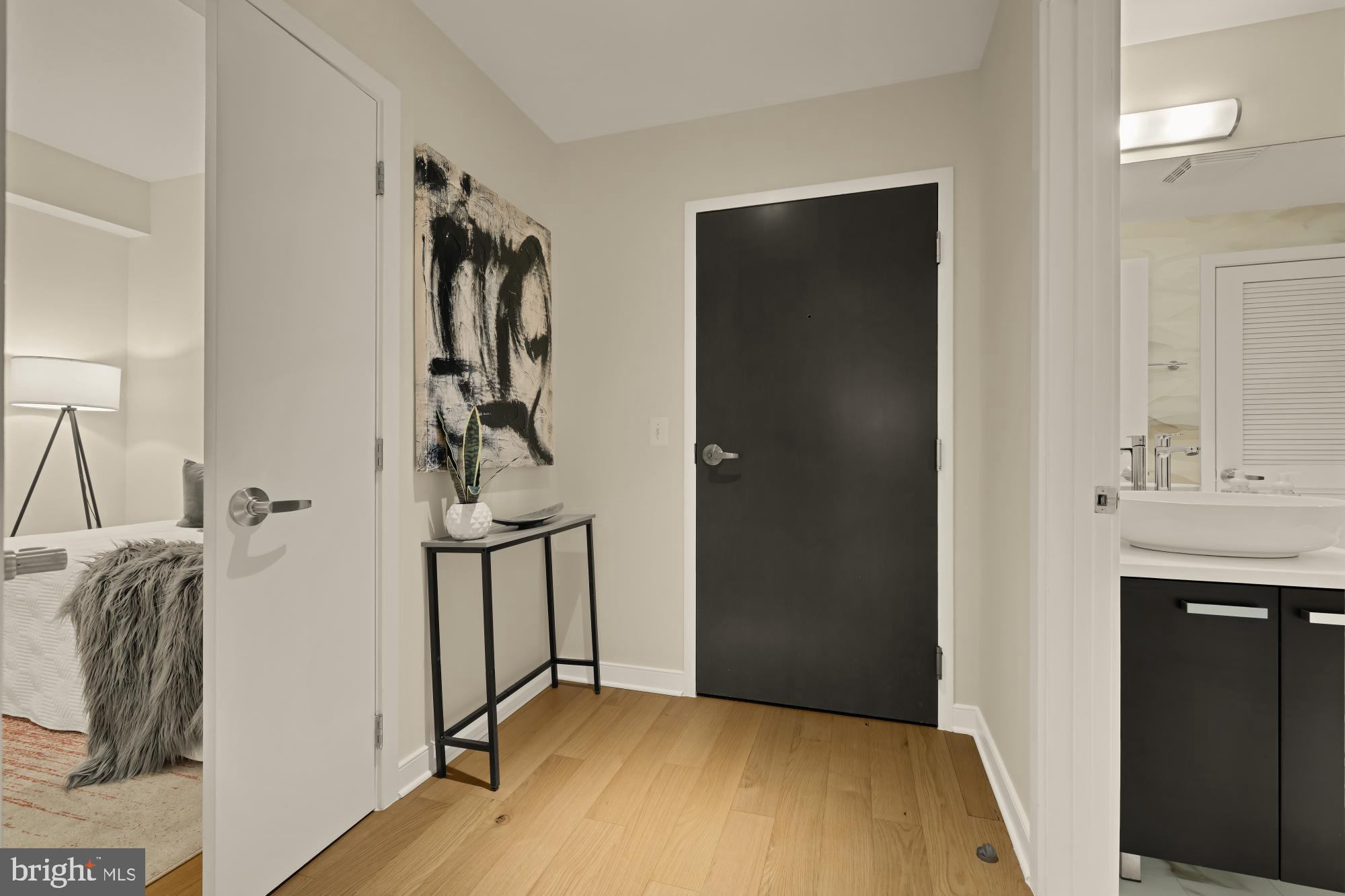 1010 Massachusetts Avenue Northwest, Unit 207 Washington, DC 20001 - Photo 3 of 31 a view of a room with a sink and a mirror