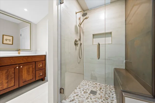 a bathroom with a shower and a sink