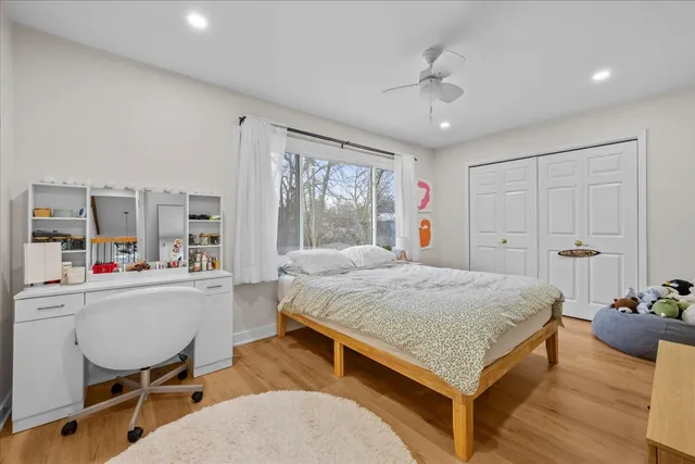 a bed room with a bed and furniture