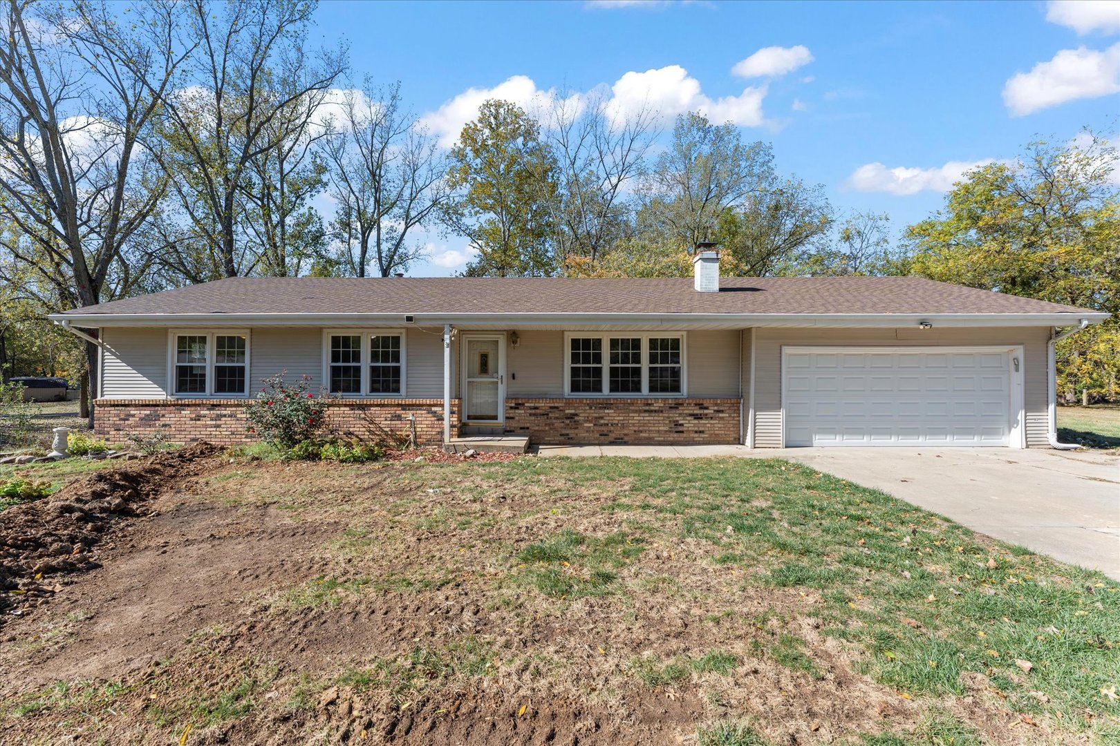 front view of a house with a yard