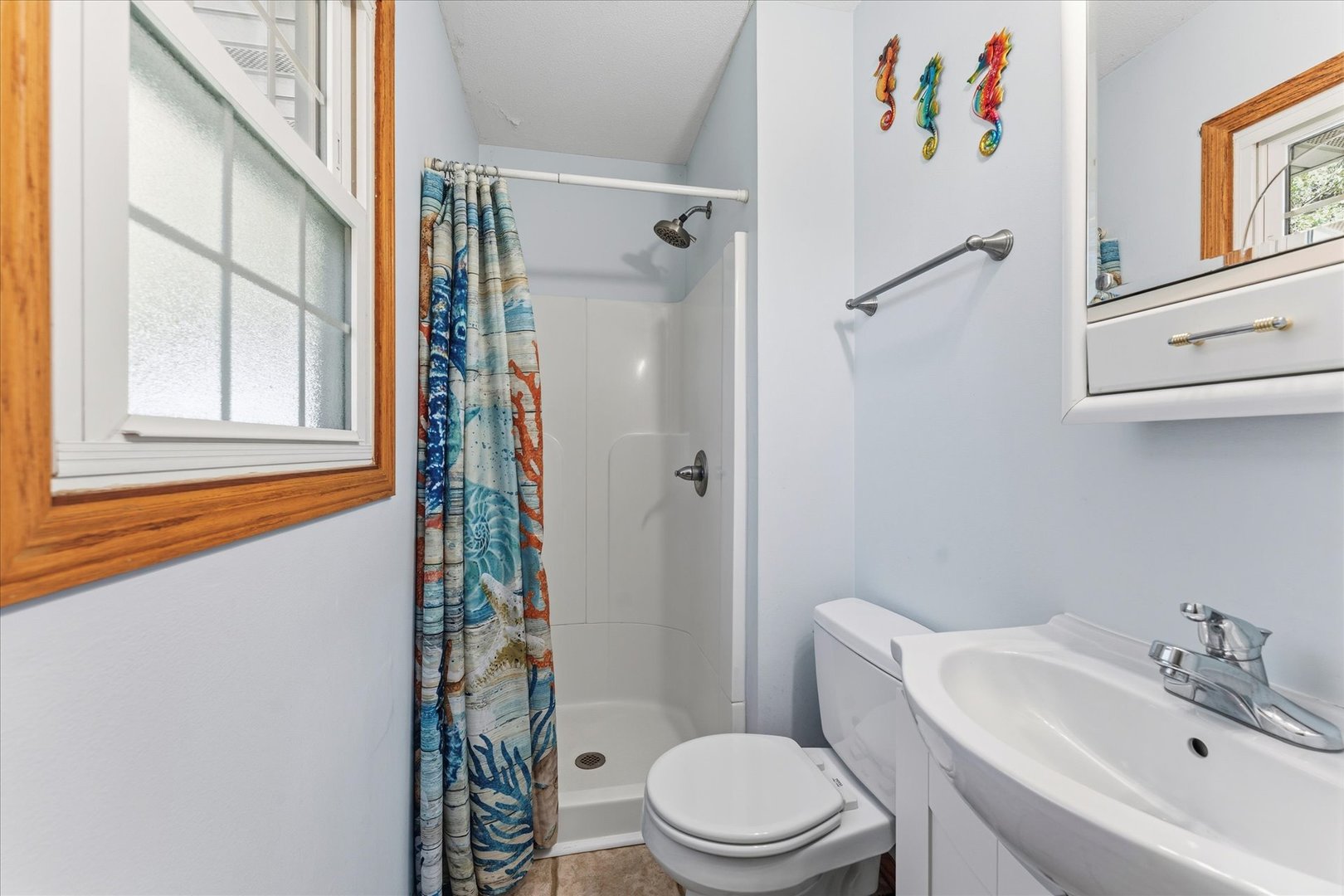 1101 McDougal Road Mahomet, IL 61853 - Photo 15 of 38 a white toilet sitting next to a bathroom sink