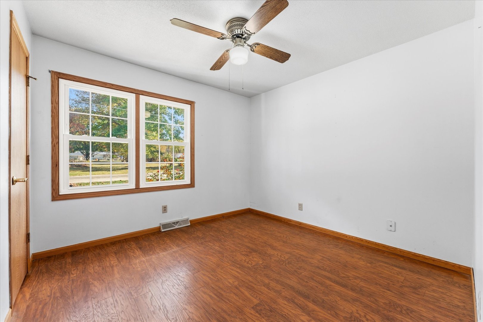 1101 McDougal Road Mahomet, IL 61853 - Photo 16 of 38 an empty room with windows and fan