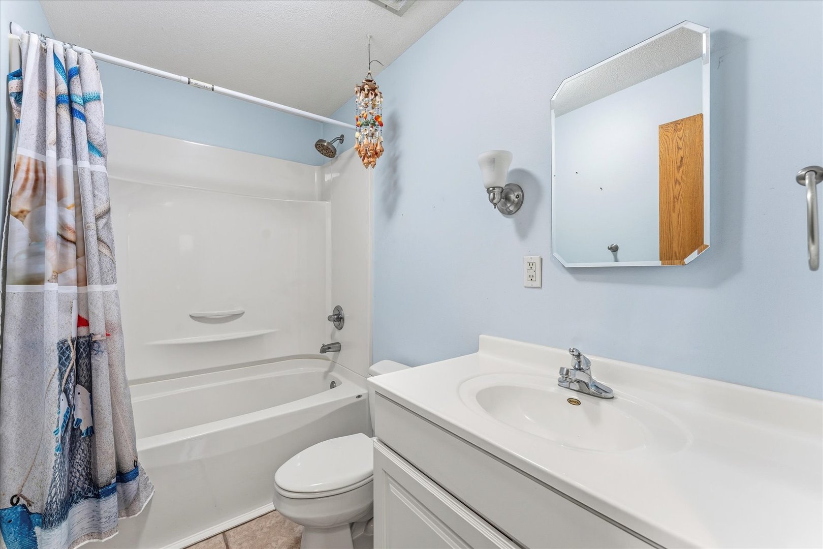 1101 McDougal Road Mahomet, IL 61853 - Photo 17 of 38 a bathroom with a sink a toilet and a mirror
