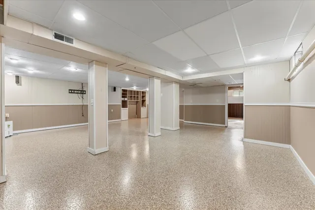 a view of a room with a refrigerator