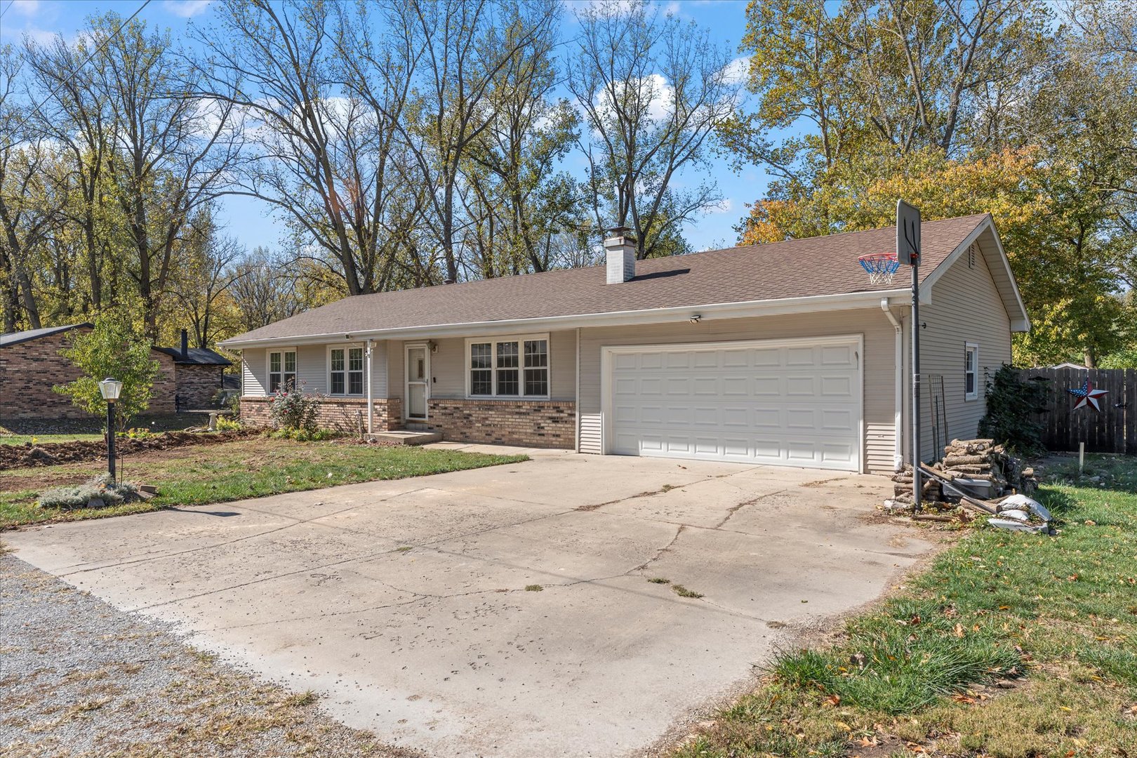 1101 McDougal Road Mahomet, IL 61853 - Photo 34 of 38 a front view of a house with a yard and garage