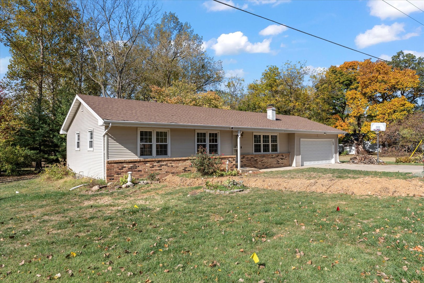 1101 McDougal Road Mahomet, IL 61853 - Photo 35 of 38 a front view of house with yard and trees in the background