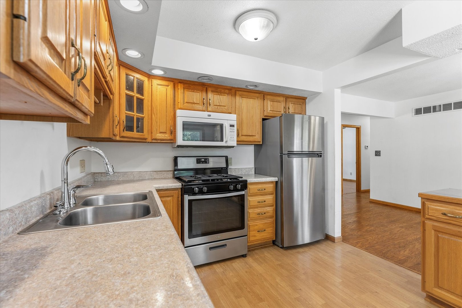 1101 McDougal Road Mahomet, IL 61853 - Photo 10 of 38 a kitchen with stainless steel appliances granite countertop a refrigerator stove and sink