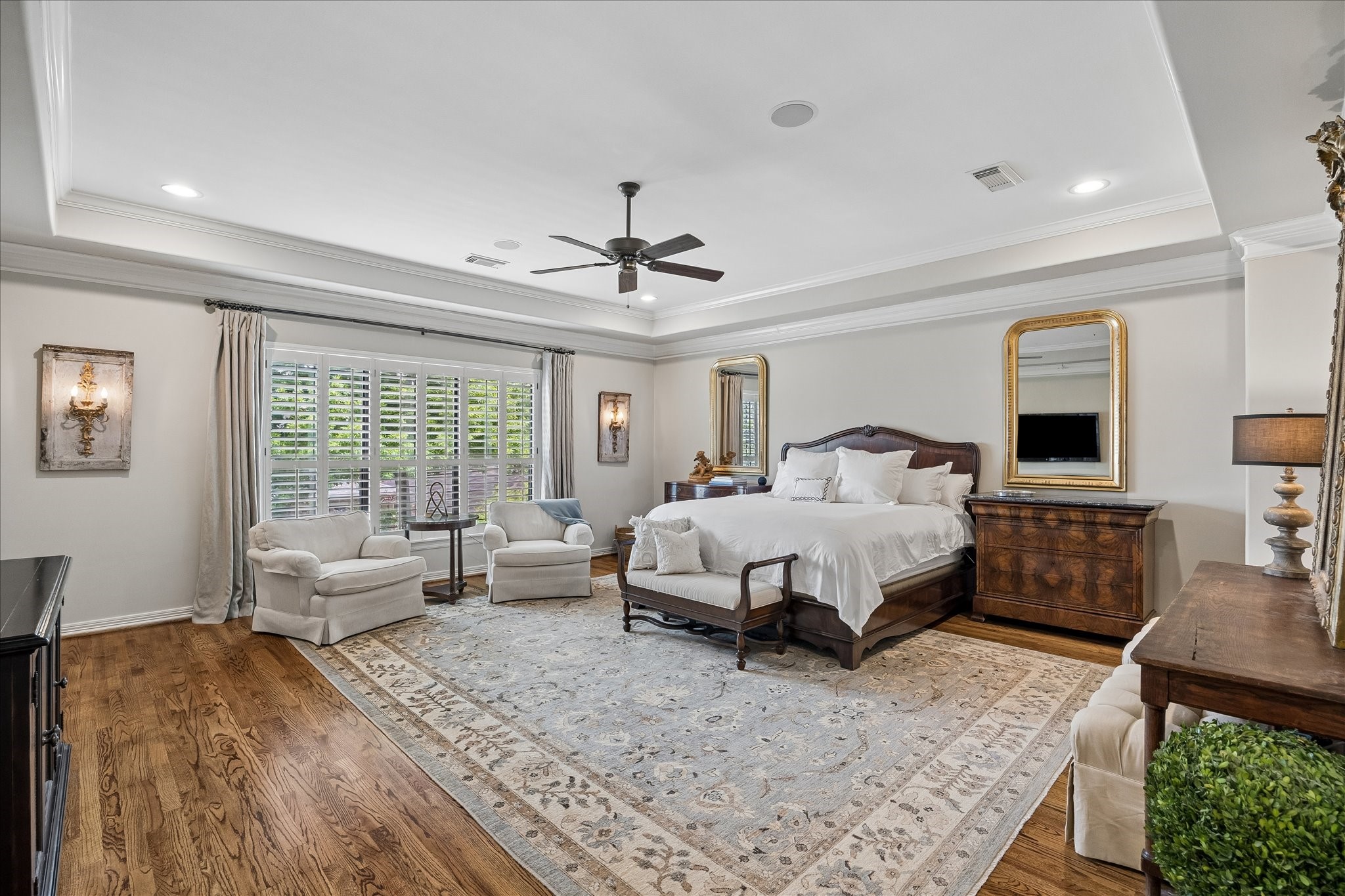 802 Anderson Street Bellaire, TX 77401 - Photo 17 of 36 The primary bedroom is on the second floor and offers coffered ceilings, triple crown molding, recessed lighting, plantation shutters, and gleaming hardwood floors.