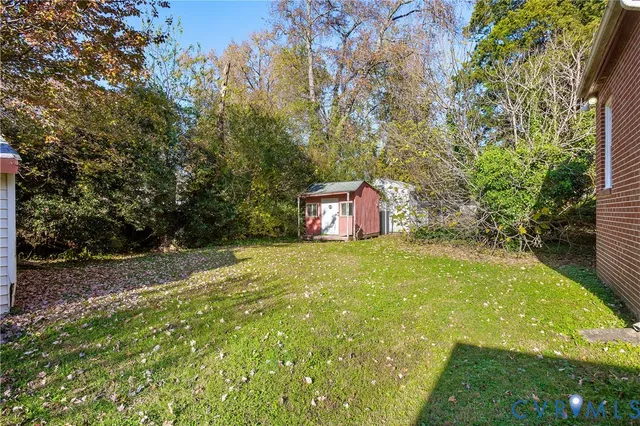 a backyard of a house with lots of green space