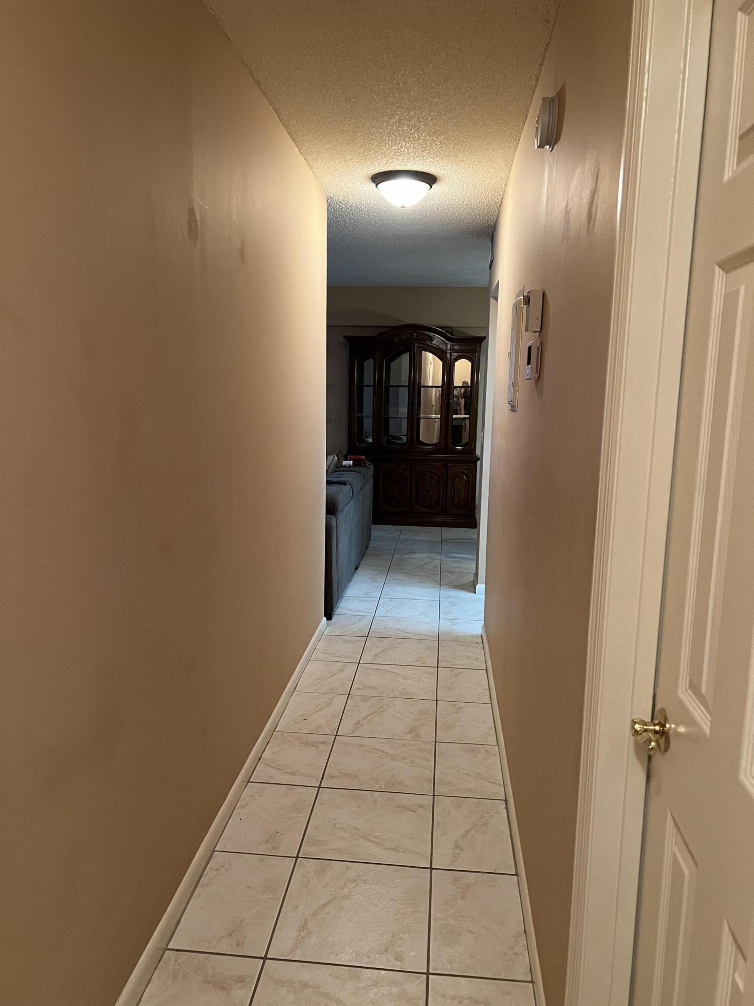 203 Suffolk F, Unit E Boca Raton, FL 33434 - Photo 19 of 27 hallway entrance