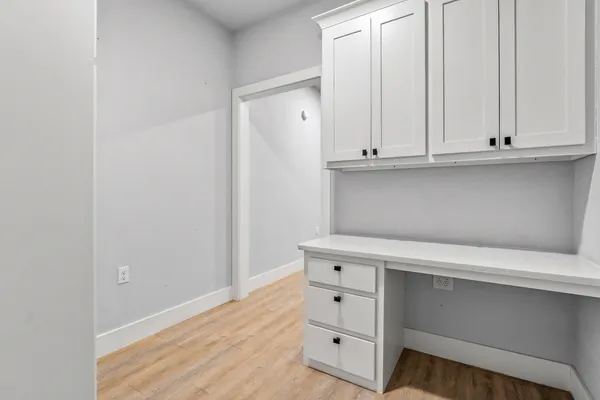 a view of an oven and cabinets