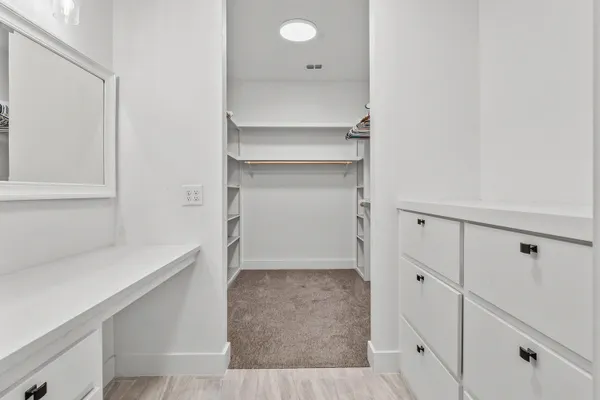 a view of an empty walk in closet