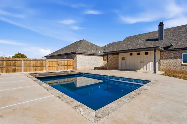 a view of a house with swimming pool