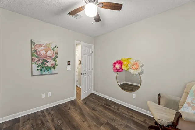 a view of a workspace with furniture and a workspace