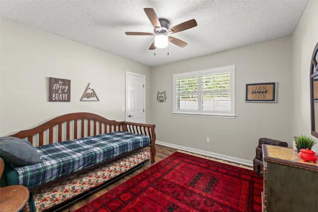 a bedroom with furniture and a window