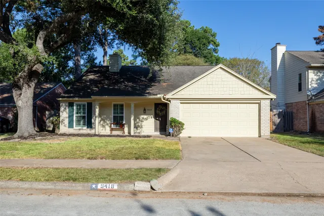 front view of a house with a garden